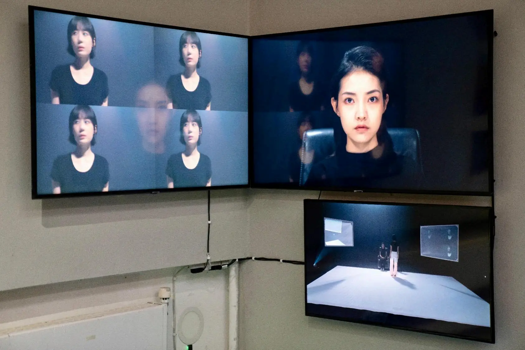 Absolute Threshold Field installed across three screens in a gallery corner