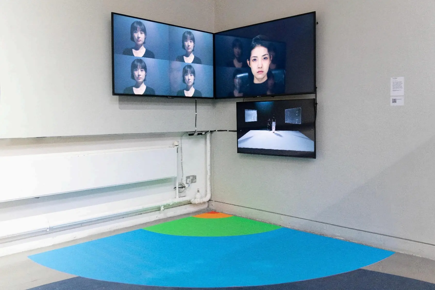 Wide view of the three-screen installation and coloured proxemic floor field