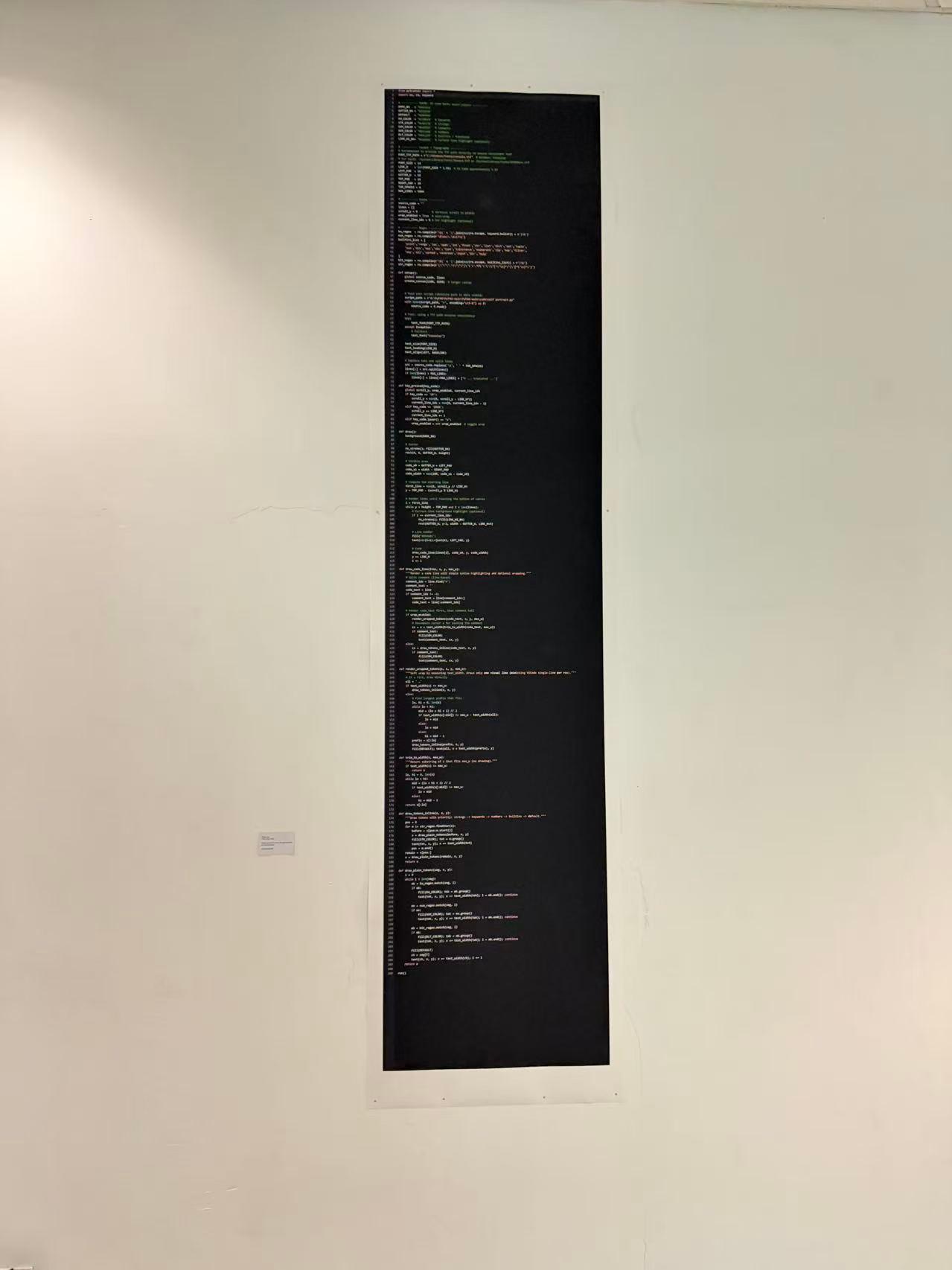 A second installation view of the tall black code print